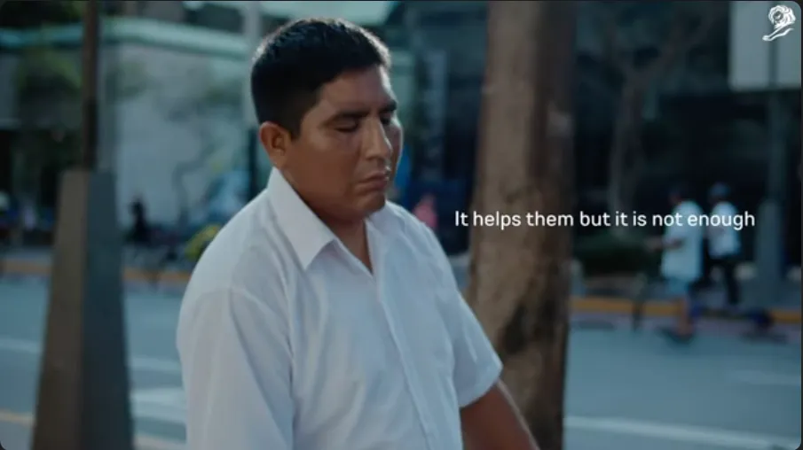 The top image highlighting a visually impaired man in a urban setting with white text reads: "It helps them but its not enough".